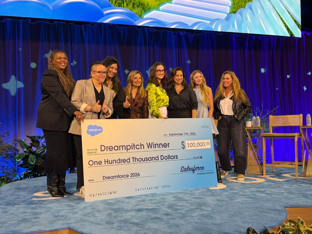 Tess Valbuena with DreamPitch 2026 co-winners and finalists holding the grand prize check at Dreamforce